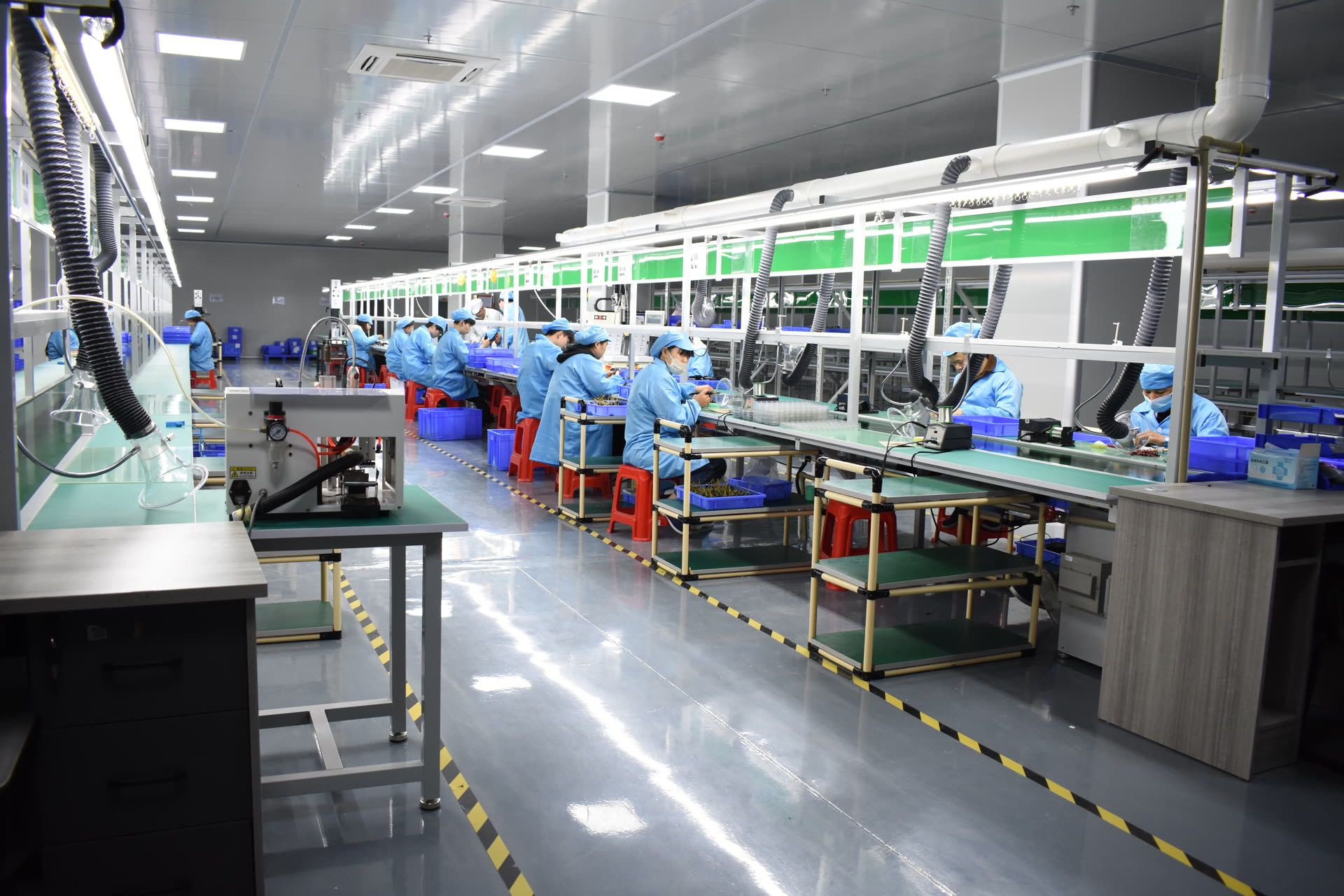 Operators assembling silicone electronic products on Leutoo's cleanroom assembly line in Dongguan